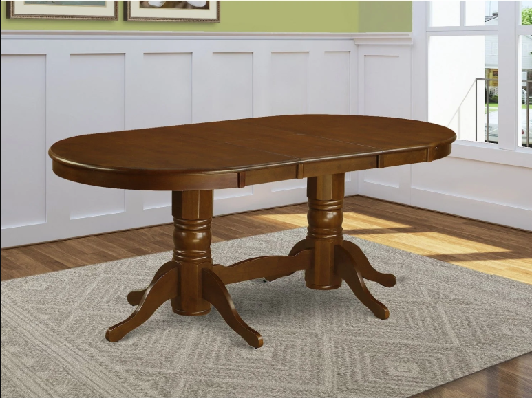 A dark brown wooden oval dining table with four legs and two pedestals sits on a beige rug in A dark brown wooden oval dining table with four legs and two pedestals sits on a beige rug in